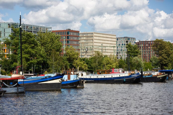 Amsterdam,,Netherlands,-,July,02,2016:,Parked,Boats,In,The