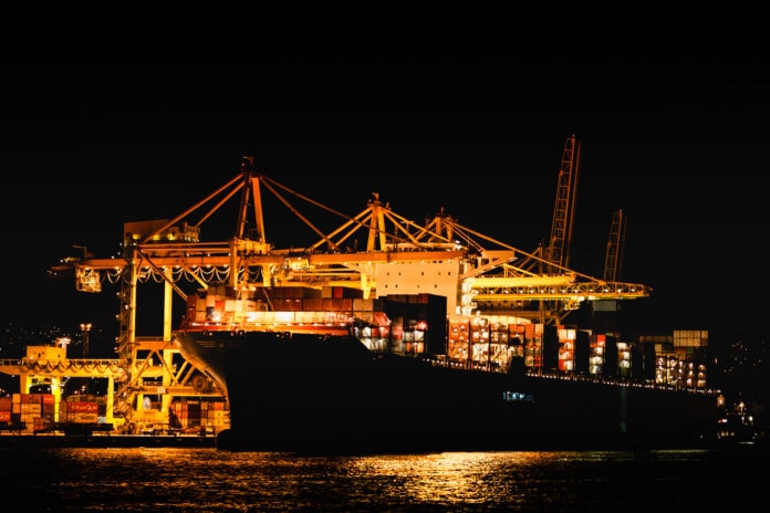 Trieste,,Italy,-,September,2019:,Night,View,Of,Trieste,Harbor schip bij haven in de nacht